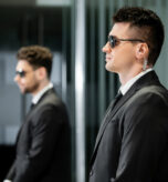 A pair of bodyguards, representing secure email protection