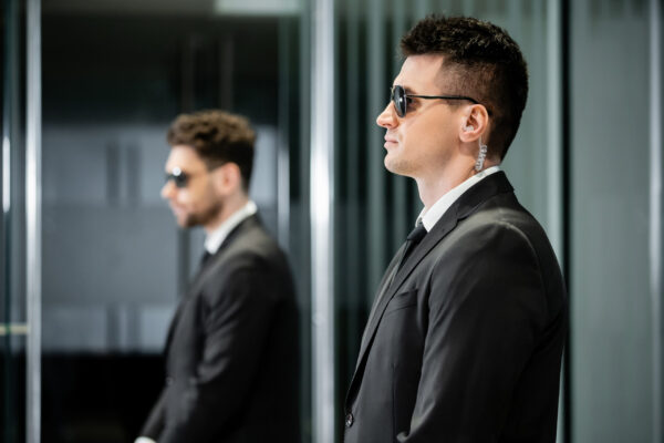 A pair of bodyguards, representing secure email protection