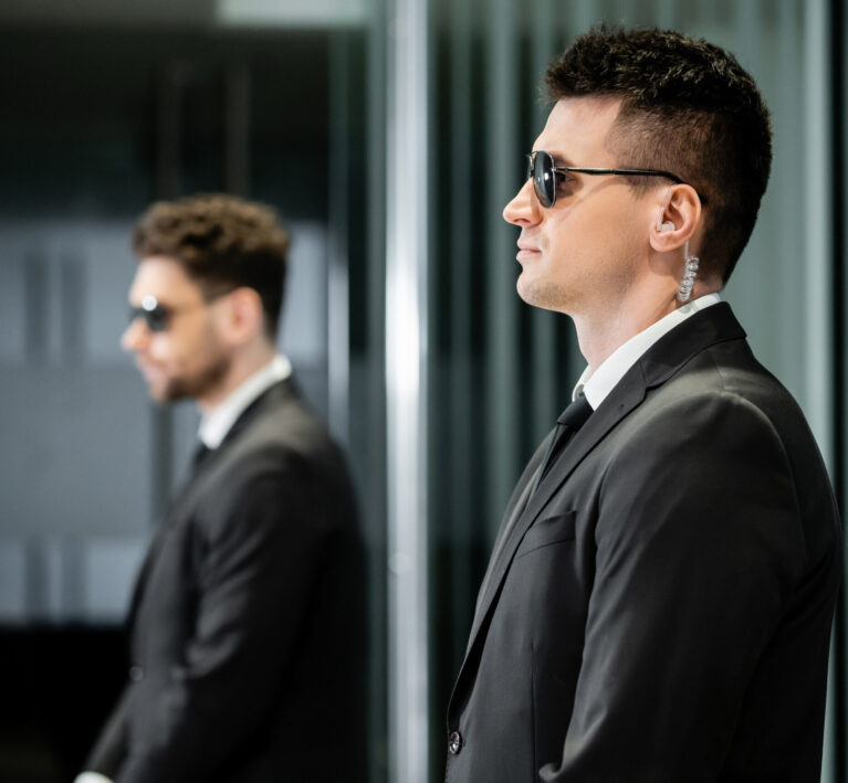 A pair of bodyguards, representing secure email protection